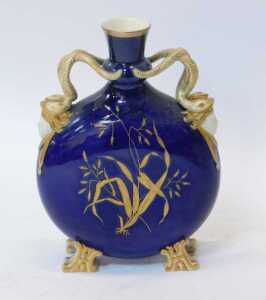 A 19thC Coalport style porcelain moon flask vase, with serpentine handles and mask heads, and a... - 2