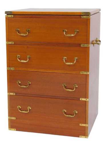 A late 20thC teak chest, with a hinged lid above four dummy drawers, with brass strapwork and...