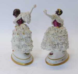 A pair of Volkstedt porcelain lace figures of ladies dancing, in flower-encrusted crinoline... - 2