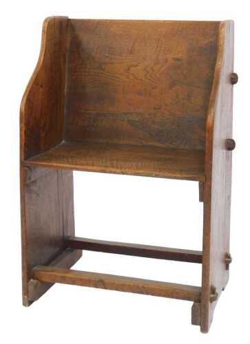 A 19thC style elm and oak church or chapel chair, with a solid seat and foot rail, 49cm wide.