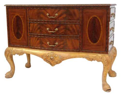 A Maitland-Smith Regency style mahogany serpentine sideboard, with three frieze drawers, and six...