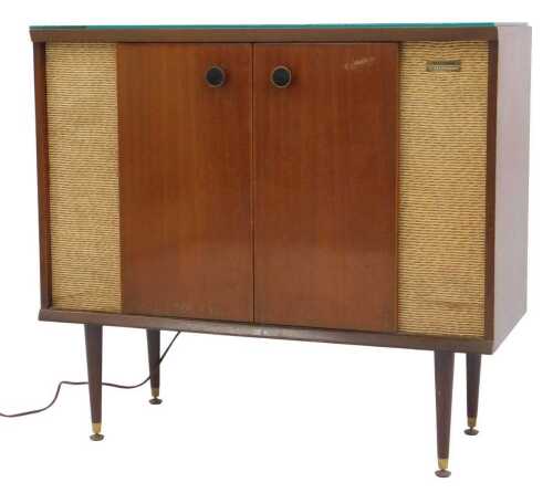 A 1950's Murphy's Stereophonic mahogany-cased radiogram, on brass-capped ebonised legs, 77cm...