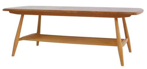 An Ercol light elm and beech coffee table, raised on turned legs united by a slatted magazine...
