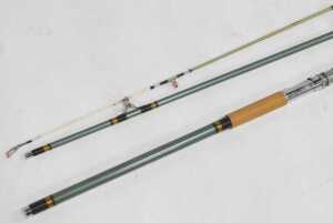 A 1960s three-piece fibreglass boat fishing rod, with porcelain ring liners, and with original... - 2