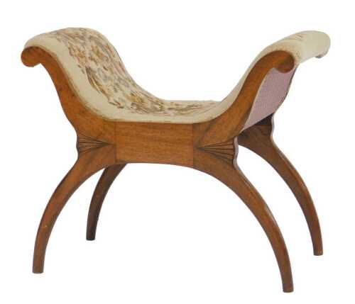 An early Victorian mahogany X framed stool, with floral woolwork tapestry upholstery, 71cm wide.