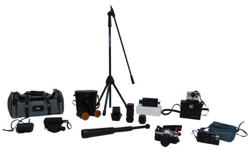 Camera and optical related equipment, to include a Polaroid camera, a Canon AE-1 camera, various...