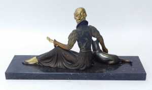 A 20thC French Art Deco patinated figure of a seated woman with an Alsatian dog, with parcel... - 2