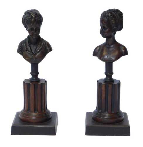 A pair of bronzed busts of young women, in the 18thC style, on pedestal stands with reeded...