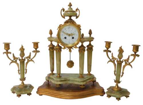 A late 19thC French three-piece clock garniture set, the drum head mantel clock with white...