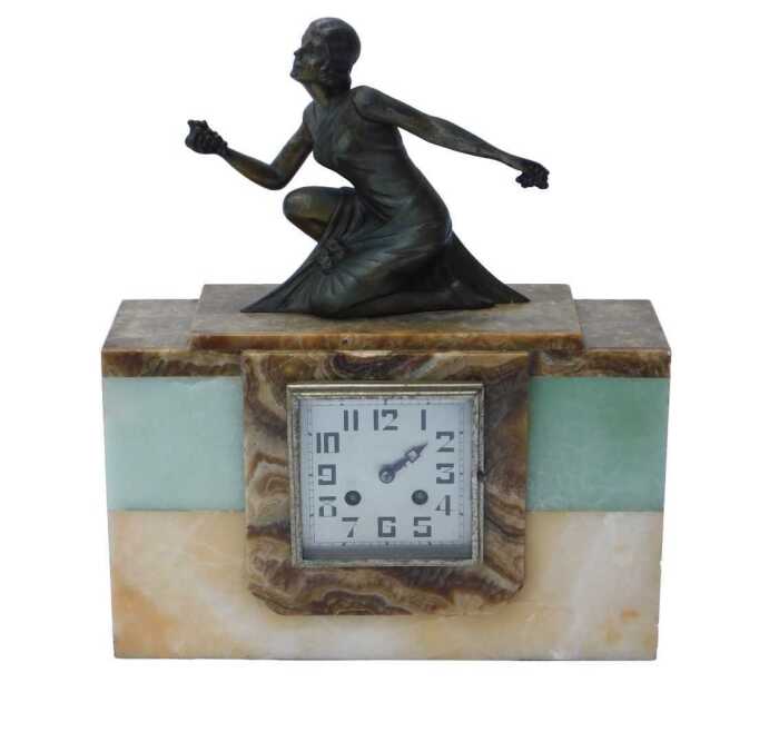 An Art Deco multi-tonal marble mantel clock, the square silvered face bearing Arabic numerals...