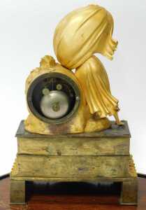 A late 19thC French Empire style gilt ormolu mantel clock, surmounted with a figure of a mother... - 3
