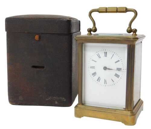 A 20thC brass cased carriage clock, the rectangular white enamel dial bearing Roman numerals,...