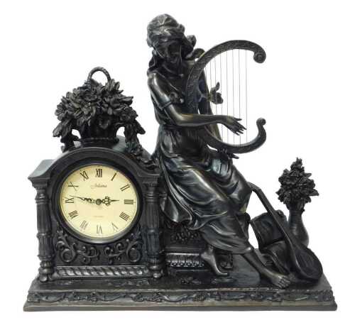 A Juliana resin mantel clock, the circular dial bearing Roman numerals, with a quartz movement...