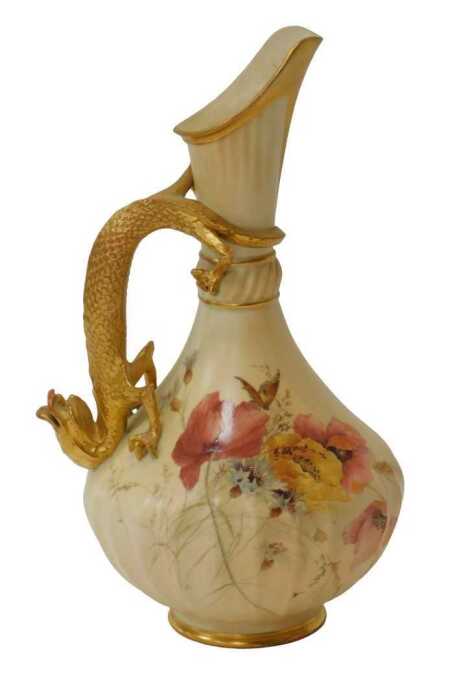 A Royal Worcester blush ivory porcelain ewer, No. 1463, with dragon handle and flared spout,...