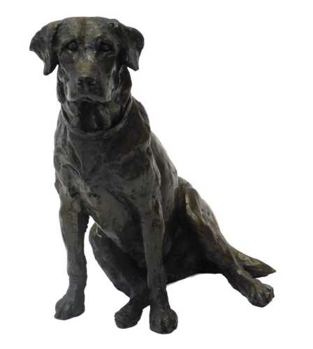 A 20thC bronzed resin figure, modelled as a seated dog, signed C Smith, 19cm high.