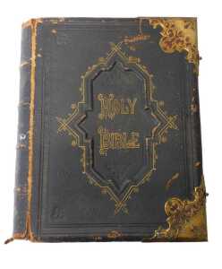 A Victorian leather and brass bound Holy Bible, with the commentaries of Scott and Henry,...