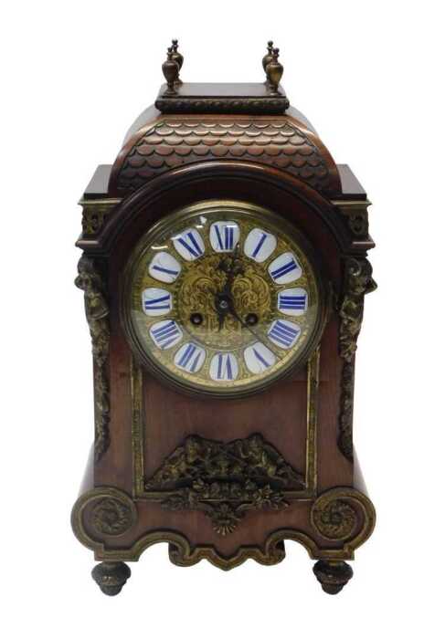A late 19thC French mahogany cased mantel clock, the circular brass dial with raised white and...