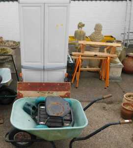 A plastic two-door cabinet, together with a wheeled garden seat, wheelbarrow, workmate, etc.