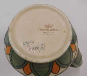 A Crown Ducal Charlotte Rhead pottery floral pattern jug, with plain spout, textured handle,... - 2