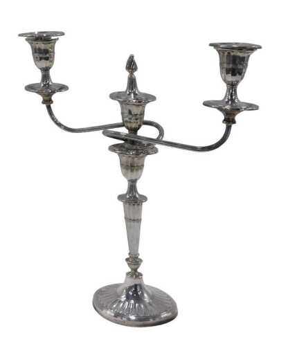 An Elizabeth II three branch candelabrum, with one flame finial, triple urn dish holders,...
