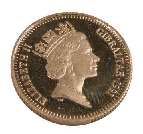 A Gibraltar 1991 gold seventy ecus fifty pound coin.