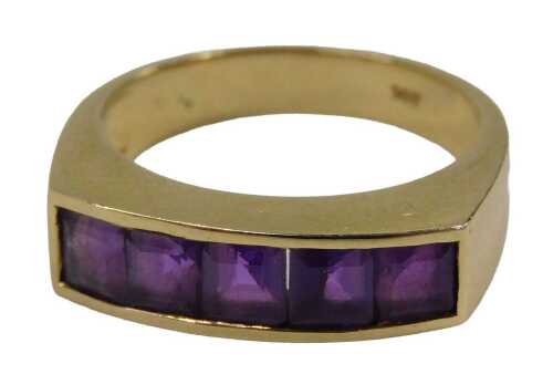 An amethyst half hoop dress ring, set with five square cut amethyst in tension settings, on a...
