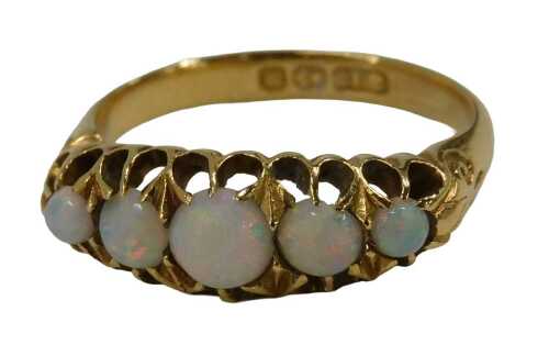 A George V 18ct gold opal dress ring, set with five graduated opals, each claw set, Birmingham...