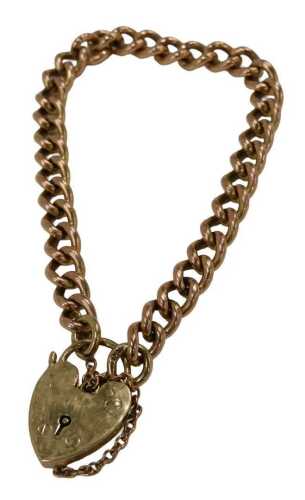 A 9ct rose gold curb link bracelet, with safety chain and yellow gold padlock, 18cm long, 19.6g.