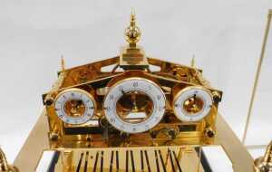 A 20thC Congreve rolling ball clock, in a highly elaborate gilt brass case, surmounted by an orb... - 3