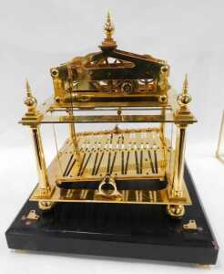 A 20thC Congreve rolling ball clock, in a highly elaborate gilt brass case, surmounted by an orb... - 4
