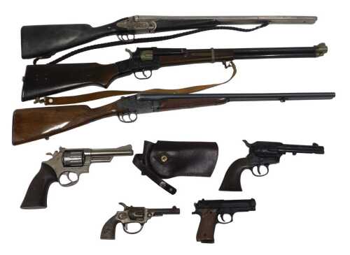 A small collection of replica and decorative wall hanging firearms, to include replica double...