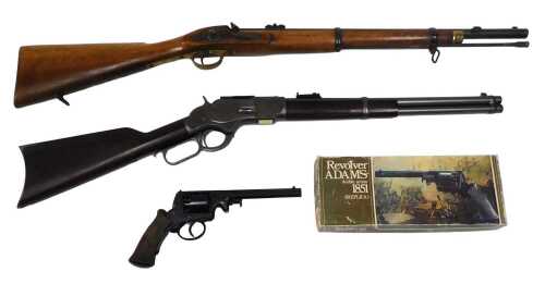 Replica guns, to include a model 1873 Winchester, an 1861 Enfield two banded rifle, and a boxed...