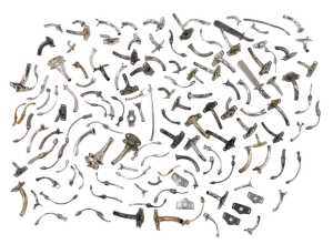 Various medical tracheostomy tubes, of shaped form with varying attachments, in white metal,...