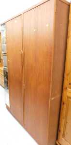 An Austin Suite teak double door wardrobe, with mirrored side.