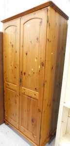 A two door pine wardrobe.