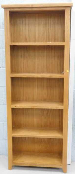 A light oak open bookcase, of five shelves.