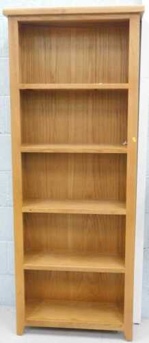 A light oak open bookcase, of five shelves.