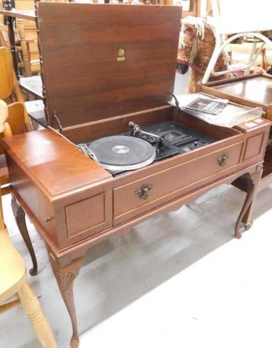 A walnut cased Dynatron radiogram, with P200 turntable, in fitted case. WARNING! This lot...