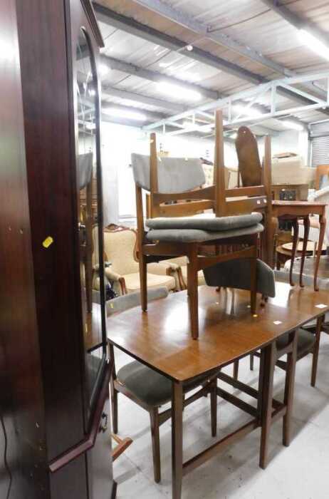 A teak gate leg table and four chairs, each with overstuffed seats, a nest of tables, and a...