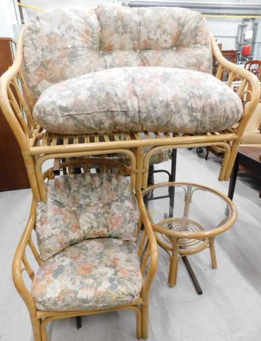 A three piece patio suite, comprising two seater settee, armchair, table, and a wooden breakfast...