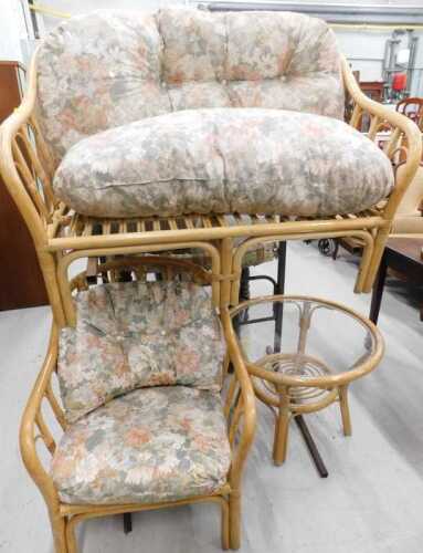 A three piece patio suite, comprising two seater settee, armchair, table, and a wooden breakfast...