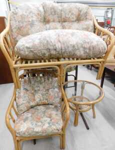 A three piece patio suite, comprising two seater settee, armchair, table, and a wooden breakfast...