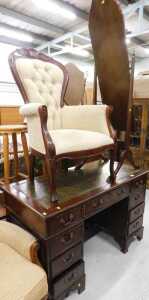 A twin pedestal desk, with one piece green leather tooled top, three frieze drawers and six...