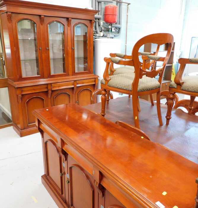 A high quality dining room suite, marked Waring & Gillows, comprising three sectional display...