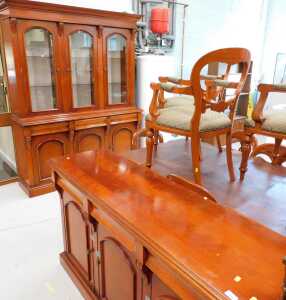A high quality dining room suite, marked Waring & Gillows, comprising three sectional display...