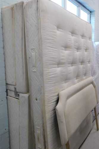 A 58" wide part floral mattress, with divan style base and headboard.