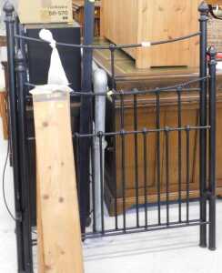 A 20thC iron single bed, comprising head and footboard, and pine slats. (a quantity)