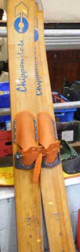 A pair of Chippendale Falcon jump skis, with fixed feet sections and wooden bases, partially...