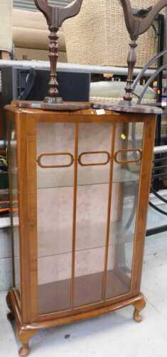 A walnut display cabinet, and two tripod tables.