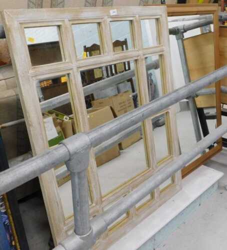 A sectional framed wall mirror.